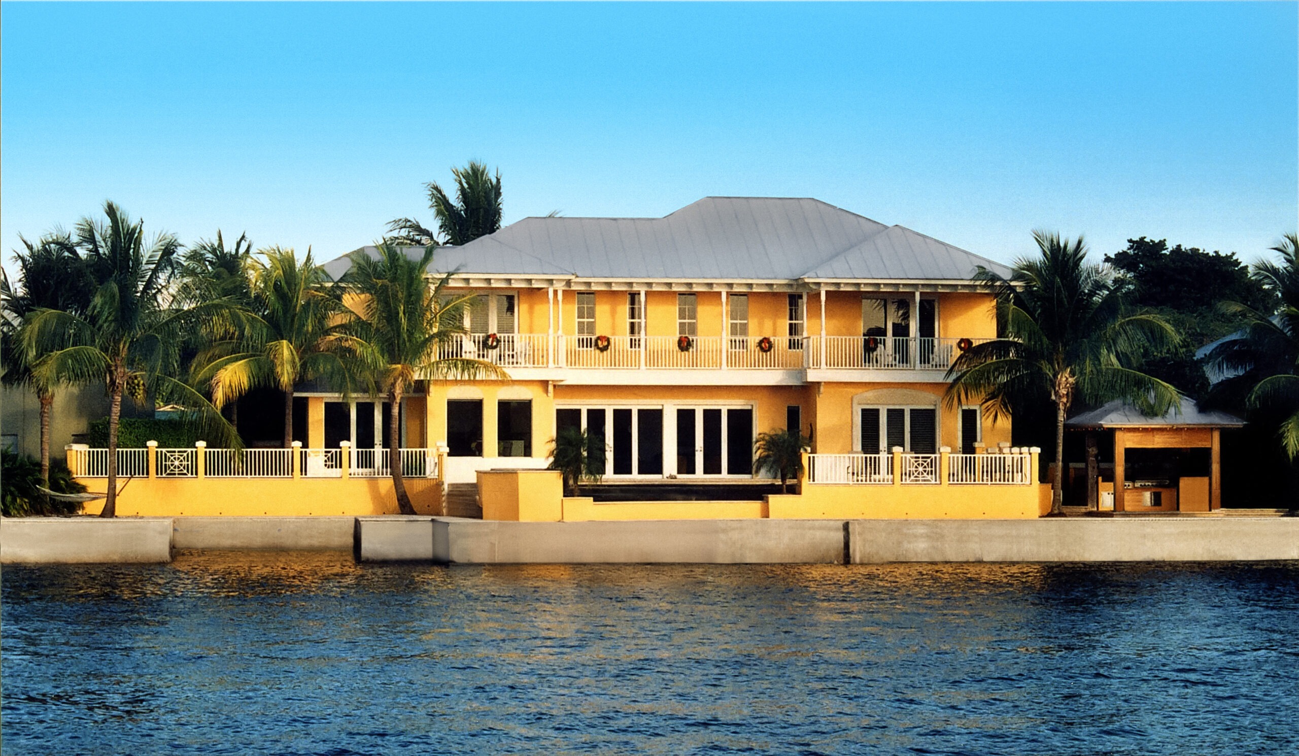 Two storey house with coconut trees