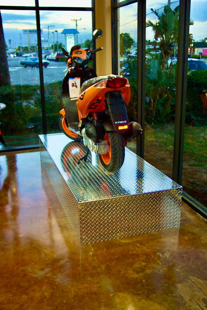 Back photo of an orange scooter
