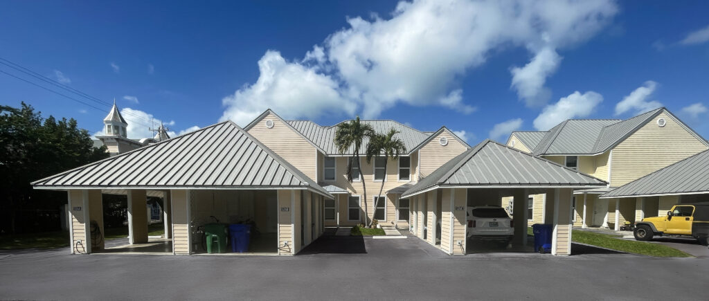 Another pearl and gray roof house with different garage doors