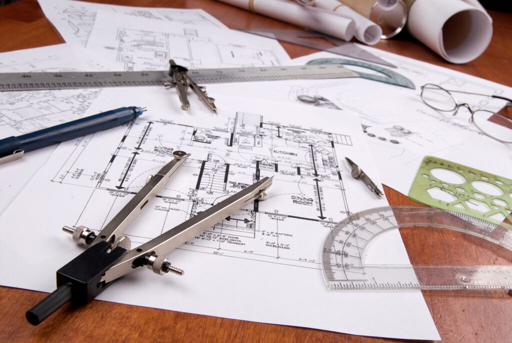 Blueprints with protectors, rulers and compass
