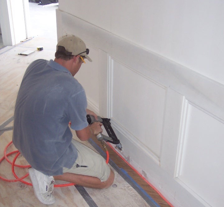 Man working on the part of a house