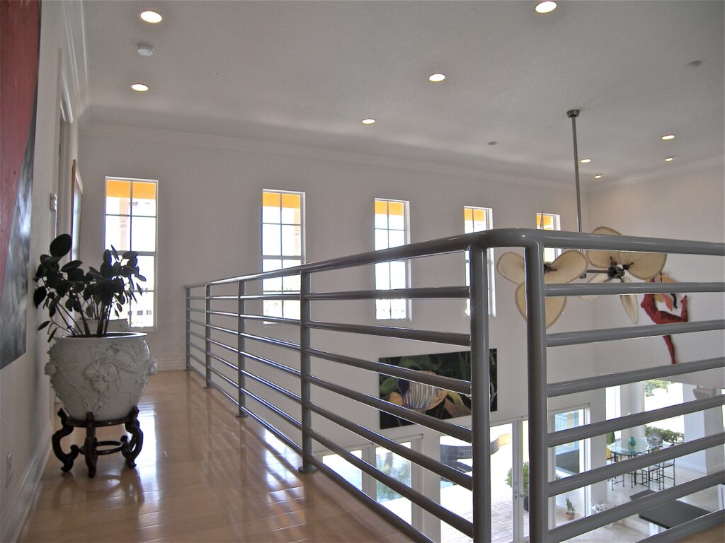 Second floor with house plants and ceiling lamp