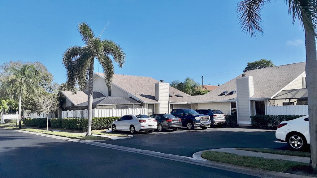 Parking area with cars and houses