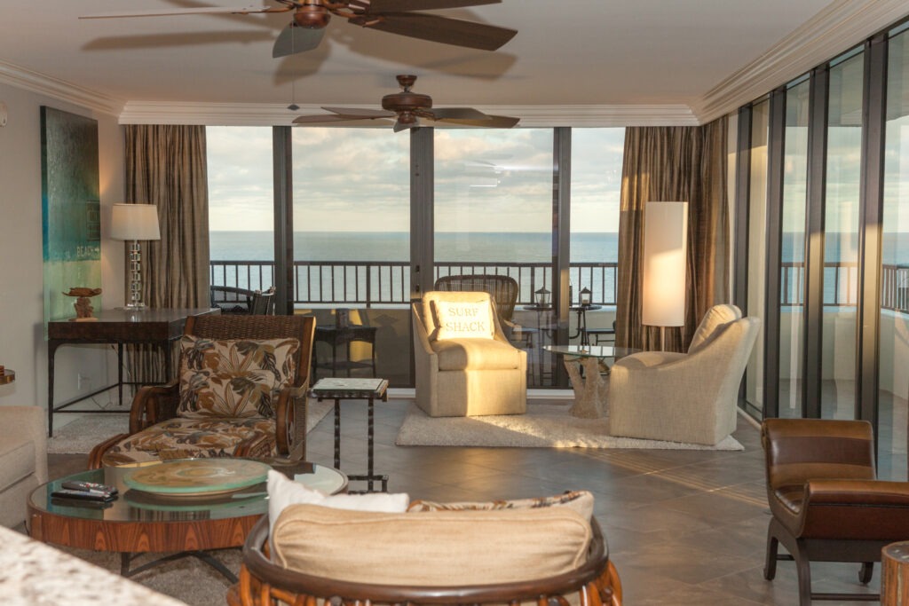 A living room with a balcony outside